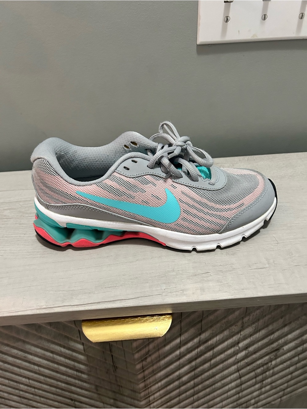 Nike Women's Light Gray Running Shoes with Teal & Pink Accents